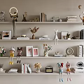 Decorative Ornaments and Figurines Collection Displayed on White Shelves with Books Vases and Dolls