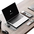 Open Apple MacBook Desktop Setup With iPhone AirPods Apple Watch On Wooden Desk