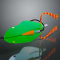 Green Decorative Ornament with Orange Accents Red and Yellow Checkered Tassels Shiny Surface