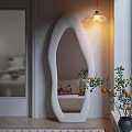 Unique Shaped White Mirror in Modern Living Room with Sofa Cushion Hanging Lamp and Plant
