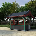 Traditional Guard Booth with Black Tiled Roof Green Red Frame and Trees Around Stone Pavement