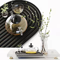 Elegant Tea Set With Glass Teapot Black Wavy Background Green Plants On White Tabletop