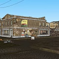 Old Brick Storefront Buildings With Vintage Signage And Utility Poles On Cobblestone Street