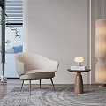 Modern Beige Single Sofa With Side Table Lamp Books Floor Lamp And Plant By Window