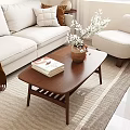 Brown Wooden Coffee Table With Stacked Books And Vase In Modern Beige Sofa Living Room