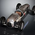 Audi Vintage Race Car With Silver Streamlined Body And Brown Leather Seat