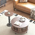 Round Wooden Coffee Table With Open Book Tray And Small Side Table By Leather Sofa