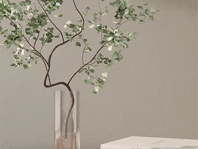 Transparent Glass Vase With Green Leaf Branches And White Flowers On Table 3d model
