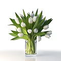 Fresh White Tulips in Clear Glass Vase with Green Leaves Decoration
