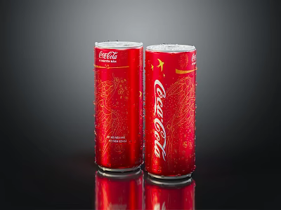 Two Red Coca-Cola Cans With Gold Accents And Classic Design 3d model