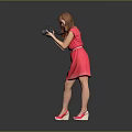 Red Dress Woman Holding Camera Against Grey Background With Pink Heels