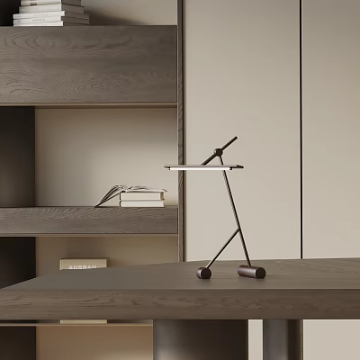 Sleek Modern Table Lamp With Metal Stand On Wooden Desk Next to Bookshelf With Books 3d model