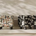 Geometric and Floral Pattern Stools With Short Black Legs on Light Colored Surface 3d model