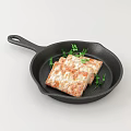 Pan Fried Meat Rolls in Black Cast Iron Skillet with Fresh Parsley