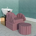 Pink Massage Chair With Ottoman In Room With Green Walls And Geometric Floor