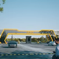 Modern Yellow Frame Entrance Gate With LOGO Vehicles And Landscaped Surroundings