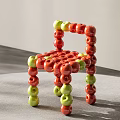 Leisure Chair Made of Red and Green Apples with Creative Design Structure
