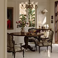 Classic Restaurant Dining Space With Round Wooden Table Patterned Chairs Vase Flower Bouquet And Framed Painting