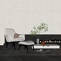 Modern Minimalist Single Sofa With Ottoman Plant And Fireplace In Cozy Living Room