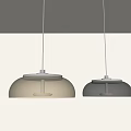 Modern Pendant Lights With Amber And Gray Glass Shades Hanging In Minimalist Interior