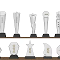Trophies and Medals Transparent Shapes Engraved Champion Special Award First Prize Black Bases on Shelf