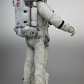 Man in White Astronaut Suit with Backpack Gloves and Protective Boots