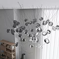 Elegant Silver Crystal Chandelier With Hanging Spherical Design In Modern Interior