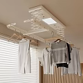 Indoor Clothes Drying Rack With Hanging Garments Near Window And Wooden Wall