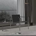 Black Leather Leisure Chair With Metal Frame And Side Table By Window Overlooking Mountain View