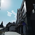 Traditional European Commercial Street With Red Brick Buildings Spires And Stone Plaza Pavement