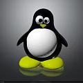 Penguin Toy Figure With Black Body White Belly Yellow Feet Big Eyes On Reflective Surface