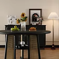 Modern Black Round Dining Table And Chairs With Beige Seat Cushions Sunflowers Bread Green Apples