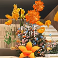 Floral Installation Design With Wooden Staircase Yellow Orange Flowers And Green Plants