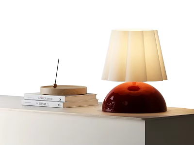 Red Base Table Lamp With Pleated White Lampshade And Books On Table 3d model