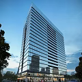 Modern High Rise Office Building With Glass Curtain Wall And Urban View