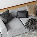 Decorative Pillows On Gray Sofa With Textured Patterns And Checkered Blanket 3d model