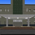 Main Entrance Gate of Building Featuring Yellow Facade Green Glass Curtain Wall Canopy Steps and Columns