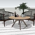 Woven Rattan Leisure Chairs With Wooden Frame Gray Cushions Round Coffee Table And Decorative Plants