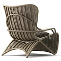 Modern Rattan Leisure Chair with Armrests Circular Pattern Cushion and Tassel Accents