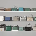 Various Stylish Handbags In Different Colors Neatly Displayed On White Shelves