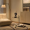 Cozy Beige Padded Single Sofa With Floor Lamp Round Side Table Rug And Wall Art