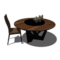 Round Wooden Dining Table With Black Center And Candle Holders Plus Matching Chair