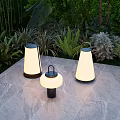 Stylish Outdoor Lights Placed On Stone Floor With Green Garden Plants