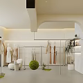 Modern Fashion Clothing Store Interior With Mannequins Hanging Clothes And Green Plants