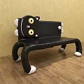 Cute Cartoon Cat Shaped Public Chair With Black Body Yellow Eyes And White Paws