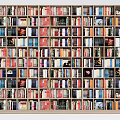 Large Bookshelf Filled With Various Colored Books And Decorative Items
