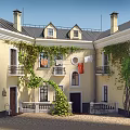 Detached Villa With Yellow Exterior Climbing Vines Balconies Roof Chimneys And Courtyard Clothesline