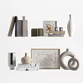 Stylish Ornamental Decor Collection With Vases Picture Frames Books And Leaf Pattern Artwork