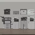 Various Office Electrical Appliances Including Multifunction Printers Copiers And Scanners Arranged Neatly