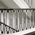Curved Staircase With Black Iron Railing And White Wall Interior Design